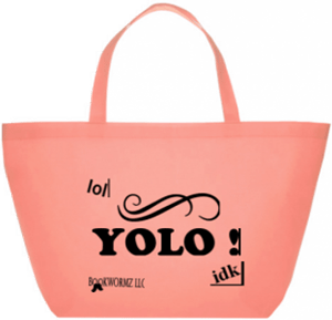 This small canvas tote bag features black lettering of a YOLO message.
